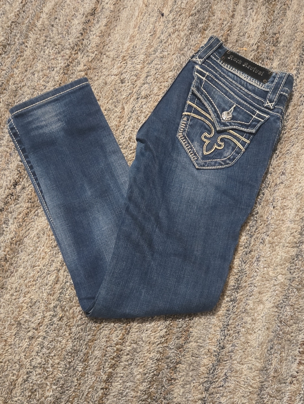 Rock Revival Women's Dark Blue Embroidered Pocket Jeans.